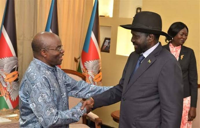 Publisher-supplied diplomatic meeting photograph of Ambassador Joram Biswaro, on the left, shaking hands with a South Sudanese leader