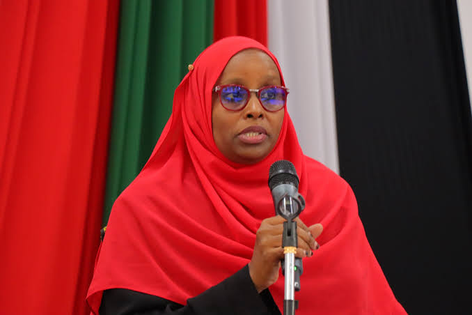 Dr Rukia Atikiya speaking at a microphone