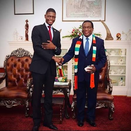 Shacky Timburwa, left, shaking hands with Emmerson Mnangagwa