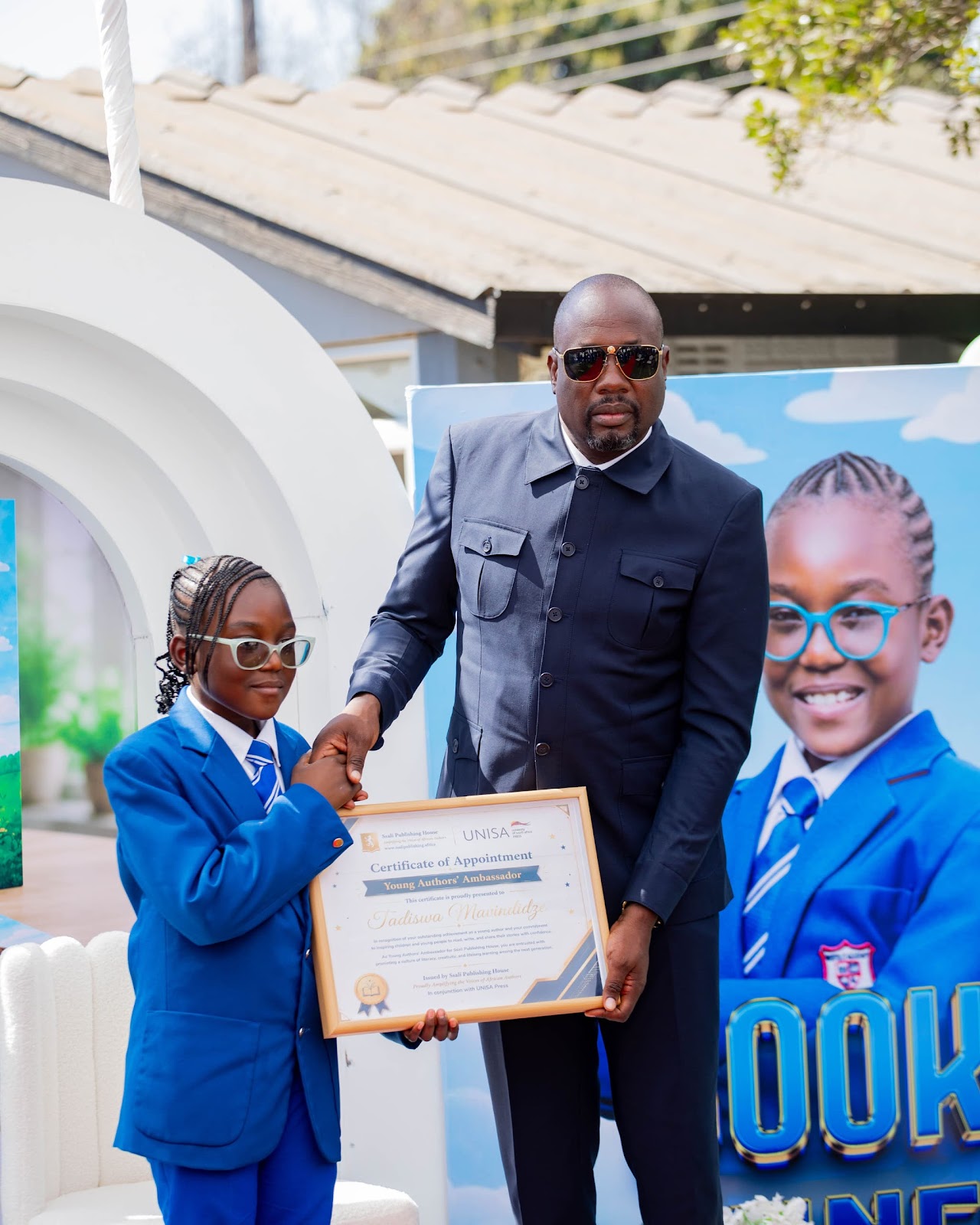 Tadiswa receiving her Young Authors’ Ambassador certificate at her book launch