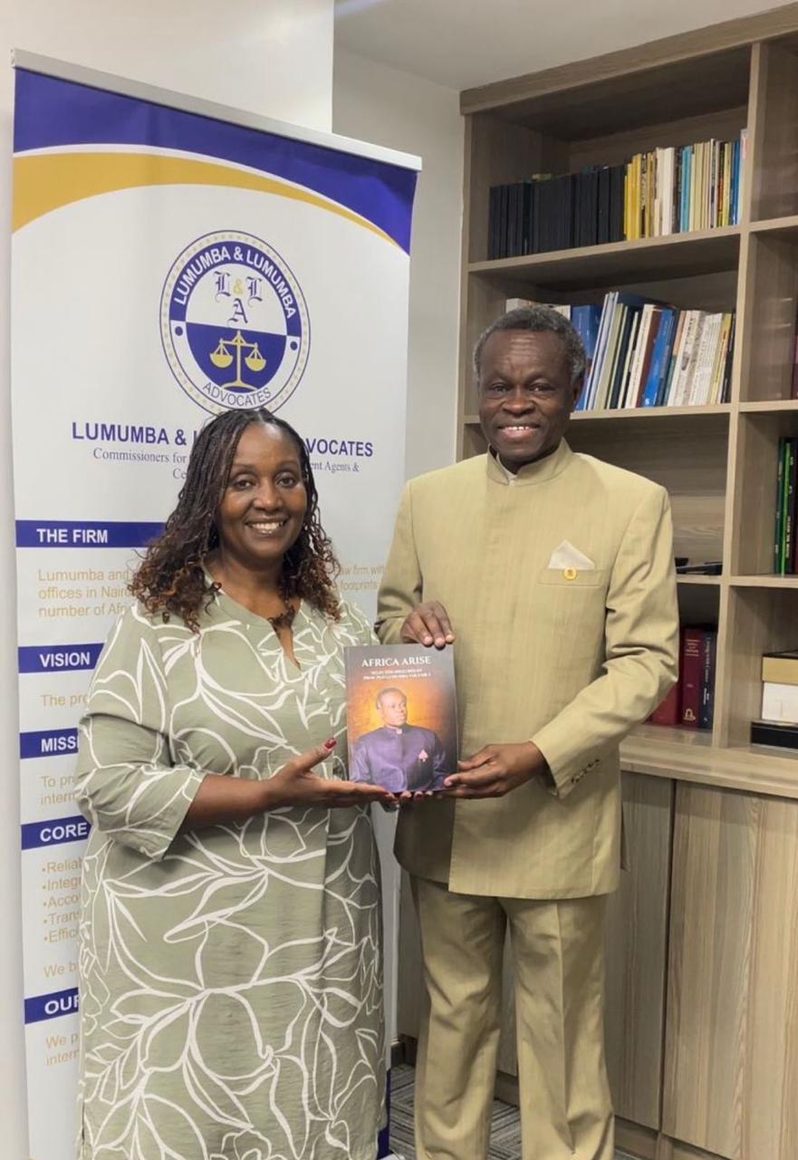 Rose Ssali, publisher, and PLO Lumumba with Africa Arise